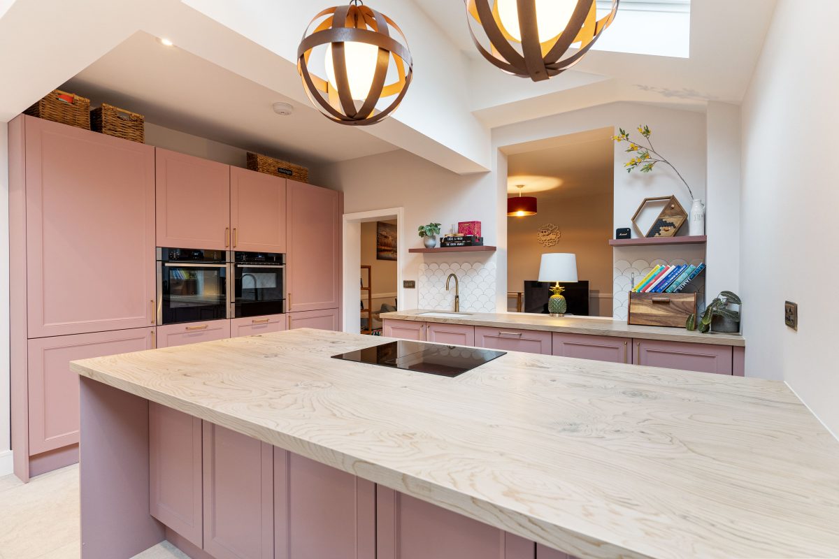 Kitchen with pink cabinetry
