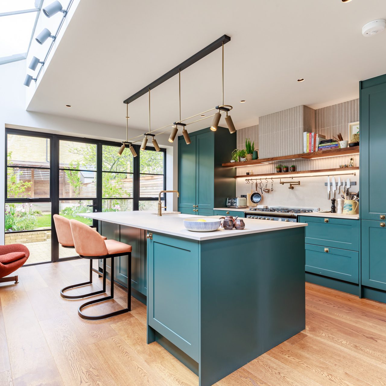 blue shaker kitchen with hanging lights